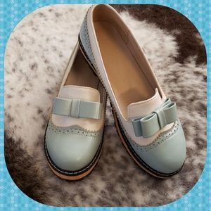 Powder blue and white leather wingtip Oxfords